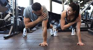 Toning Bingo Wings: Your Ultimate Guide to Sculpting Sleek Arms at the Gym 3 Fitness trainer demonstrating arm toning exercises Leighton Buzzard
