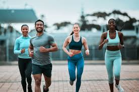 Sculpting Sleek Arms: The Essential Role of Cardio in Toning Without Bulking Up 3 image of people running to incorporate cardio Leighton Buzzard exercise into their life to help tone arms and body.